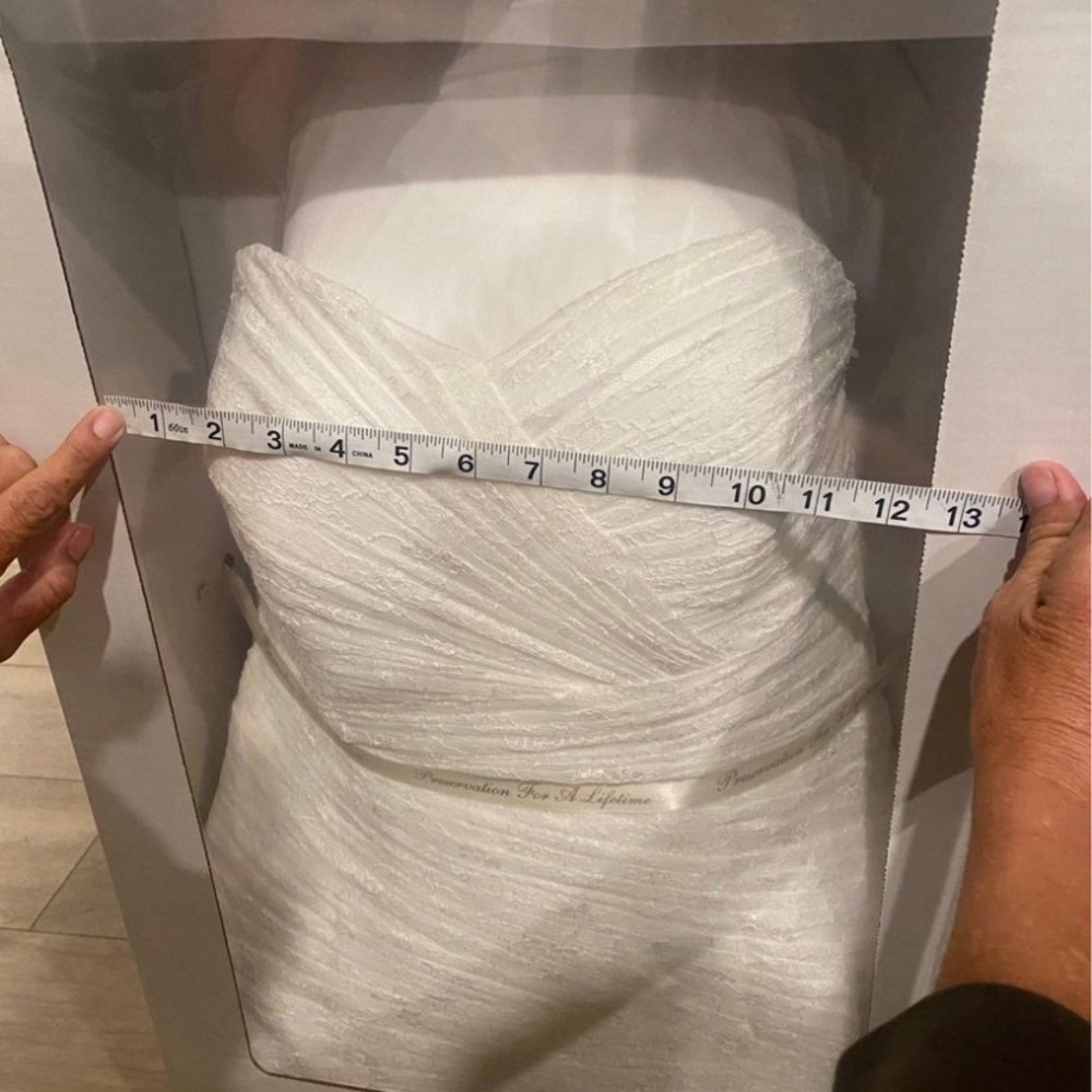Lace wedding gown from David’s Bridal.
Size is somewhere 14-16
